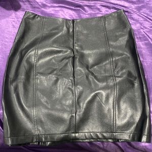 Medium high waisted leather skirt. Black. Two front slits NWT
